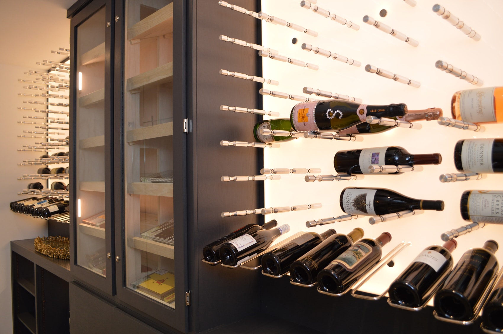 Looking for the perfect wine racking system for your business? You could never go wrong with a metallic racking system. Click now to see for yourself. Modern Wine Cellar illuminated by LED lights