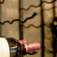 Indentations and rubber stoppers prevent the bottles from rolling out.