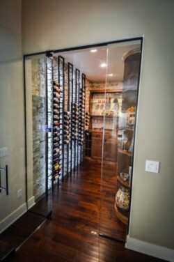 9 - To make both the wood and metal stand out in this home wine cellar, our team carefully selected the stains and finishes for the wine racks. They also made sure that the wine racks are in the correct placement to show off warmth and sleekness. To make both the wood and metal stand out in this home wine cellar in San Diego, Coastal Custom Wine Cellars carefully selected the stains and finishes for the wine racks. They also made sure that the wine racks are in the correct placement to show off warmth and sleekness.