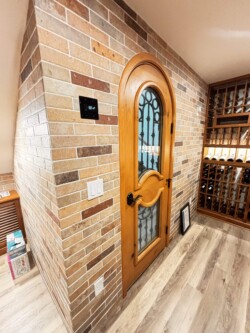 6 - The view of custom wine cellar door inside the home wine cellars